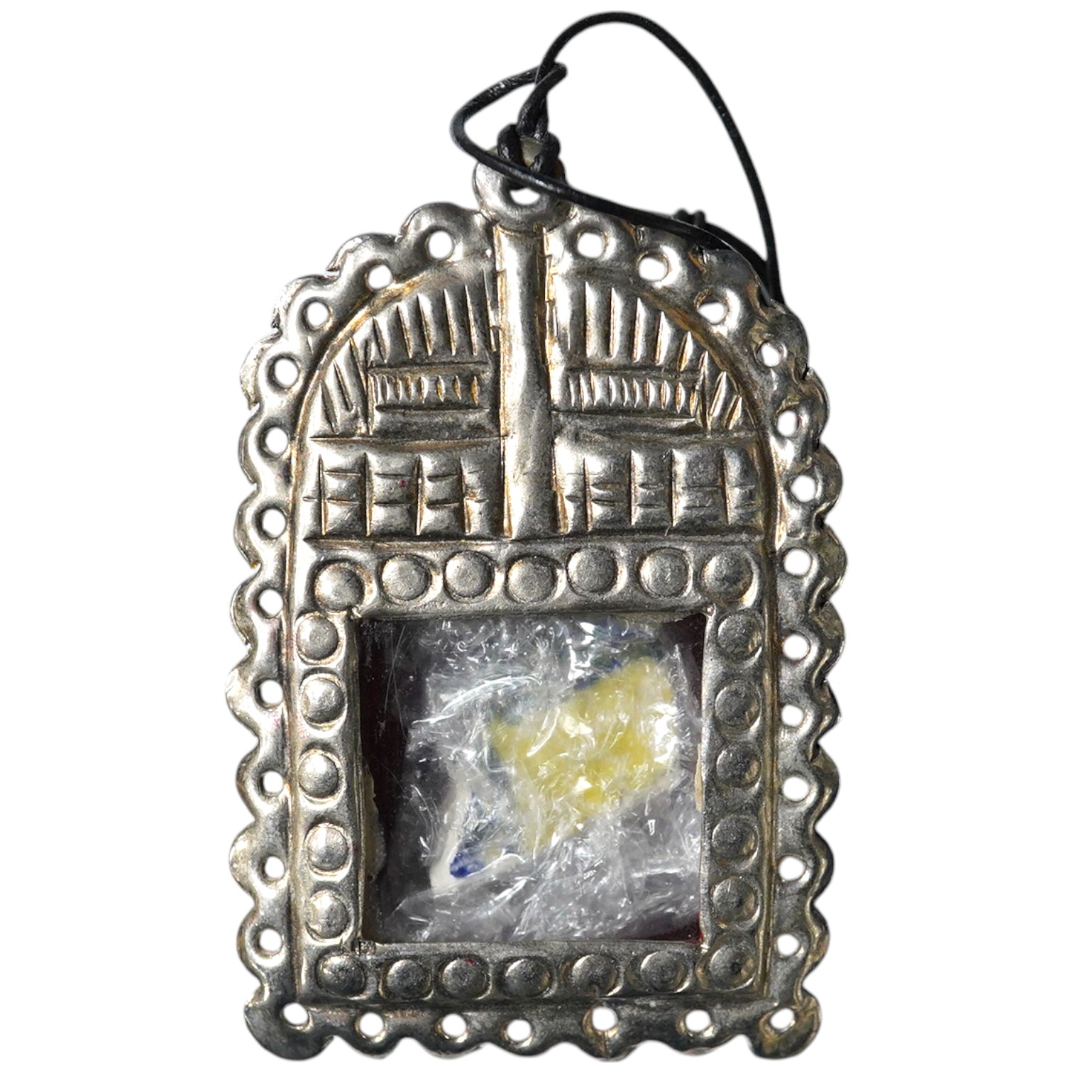 A Grayson Perry reliquary white metal pendant containing a section of tile, with Tate box, 7.5cm high. Condition - good